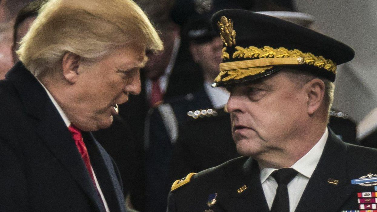 Former President Trump, left, shakes hands with General Mark Milley.