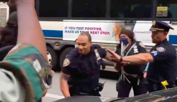 VIDEO: Black Lives Matter protesters call NYPD cop the N-word — and the officer has to be restrained by his colleagues