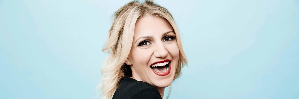 Annaleigh Ashford smiles very broadly