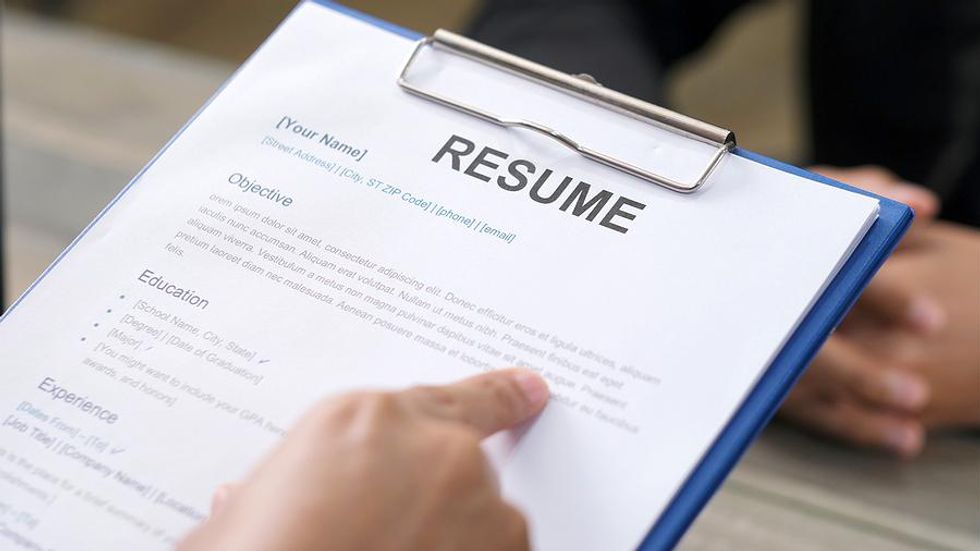 Hiring manager refers to resume during a job interview