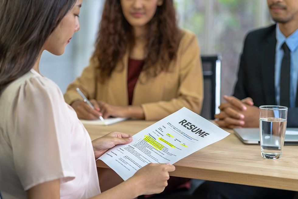 Woman reviews her resume before a job interview