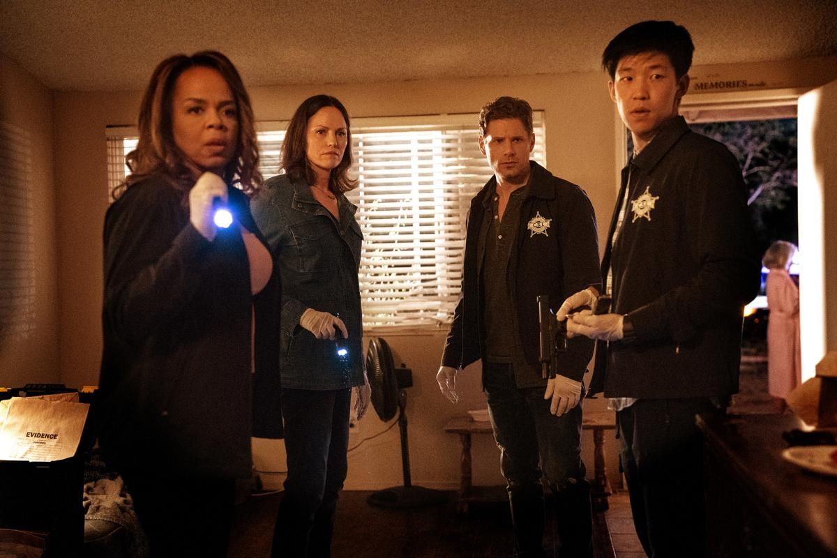 The stars of CSI: Vegas examining a crime scene