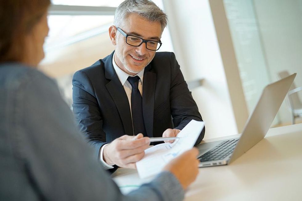 Manager talks to an employee during a performance review