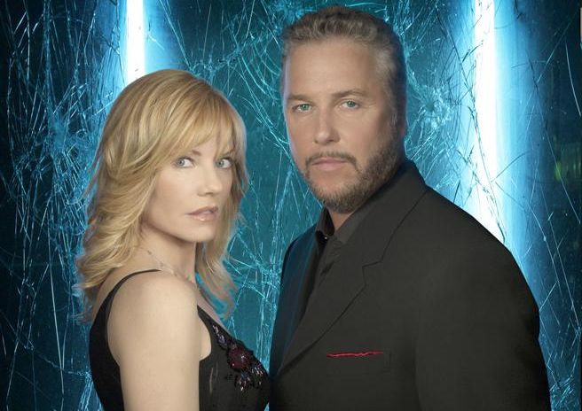 Marg Helgenberger and William Petersen pose in front of a background of cracked glass