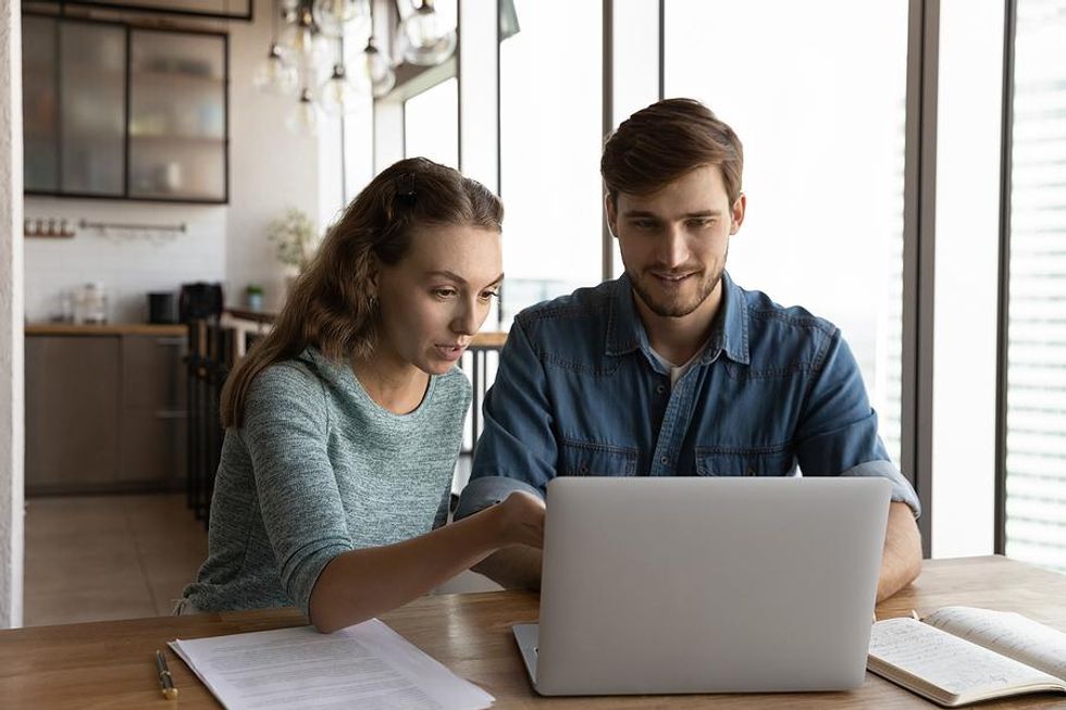 Recent college grad listens to a mentor at his new job