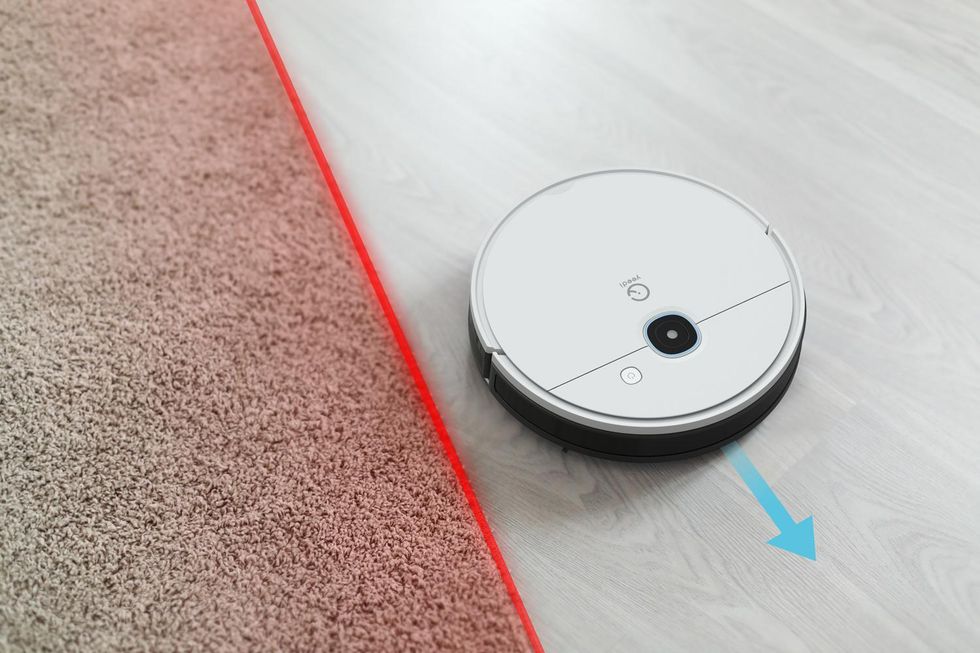 A Yeedi smart robot vacuum mopping the floor .