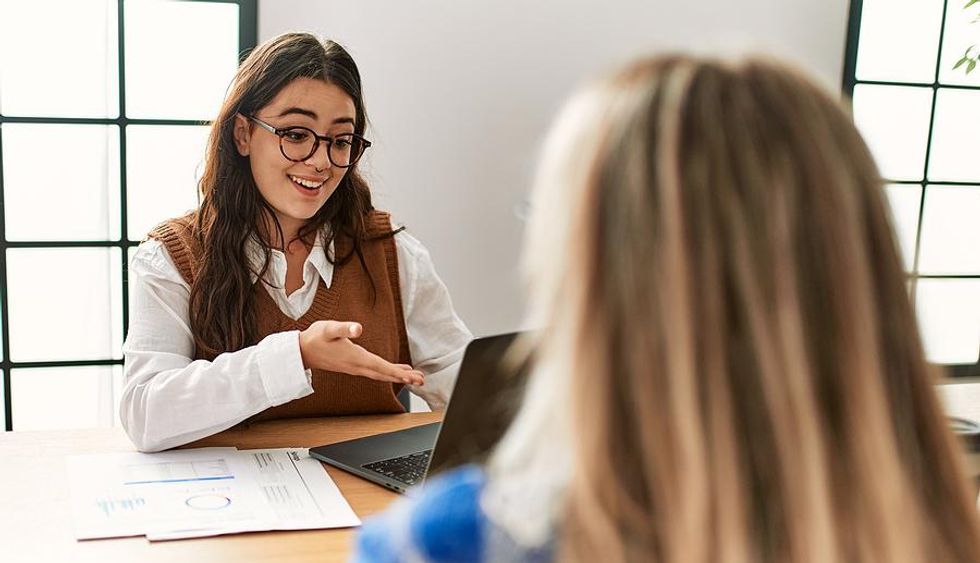 Hiring manager interviews a job candidate in the fall