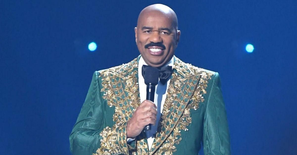Steve Harvey Just Showed Off His Green Suit While Visiting Paris—And The Internet Photoshopped The Crap Out Of It