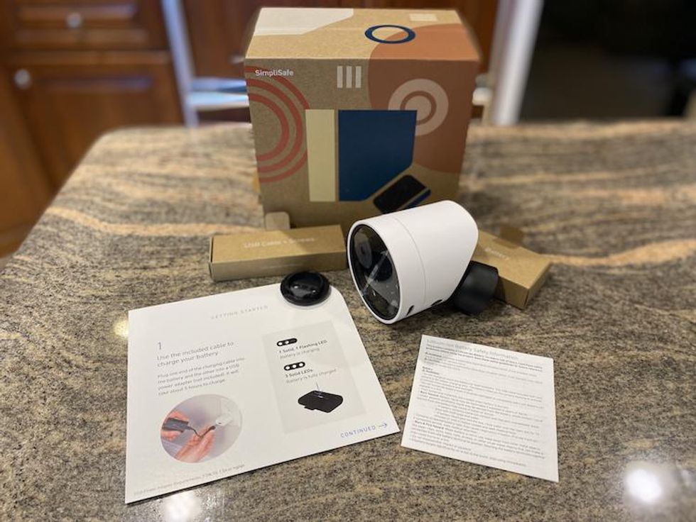 SimpliSafe Wireless outdoor Security camera unboxed on a countertop