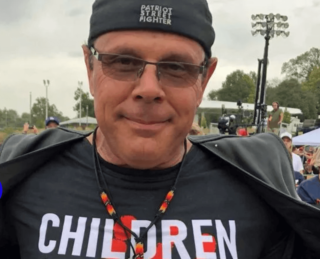 Tomahawk-Wielding QAnon Shill Threatens School Board In Iowa