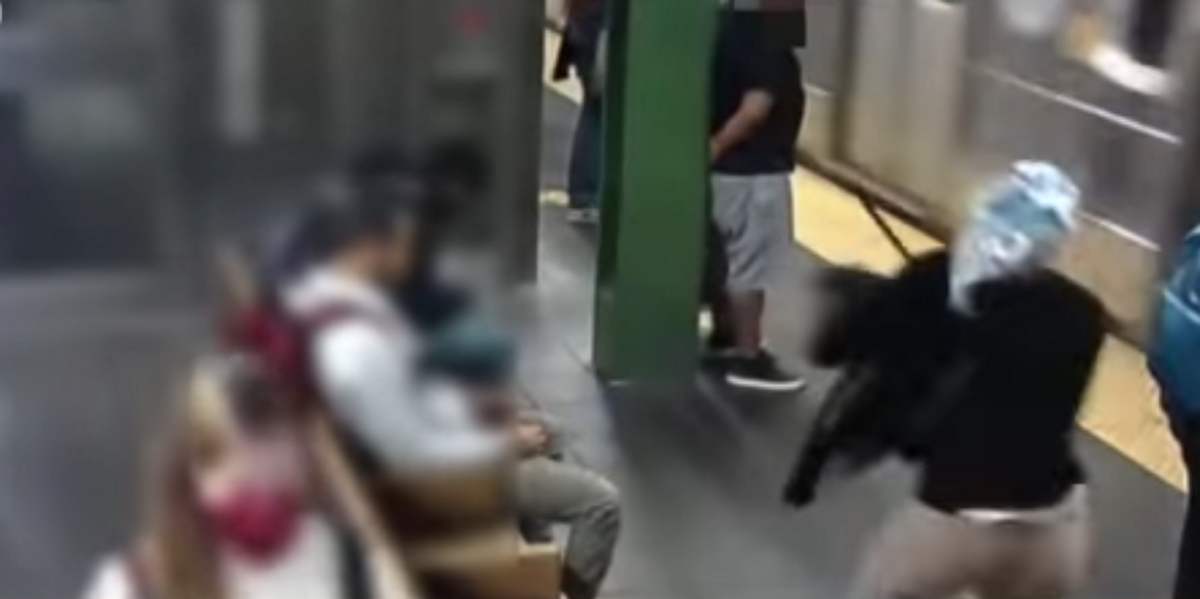 NYC woman caught on video pushing commuter into moving subway train NYC woman caught on video pushing commuter into moving subway train