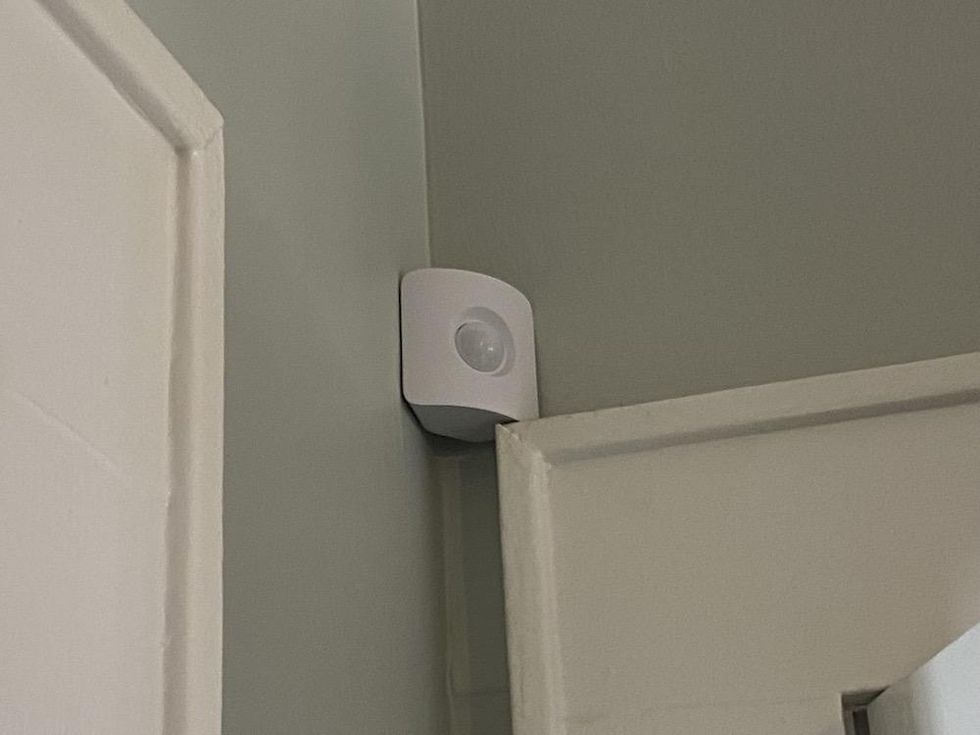 SimpliSafe Motion Sensor Intalled on a wall in a home.