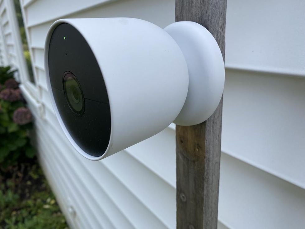 Google nest Cam outside on the side of a house.