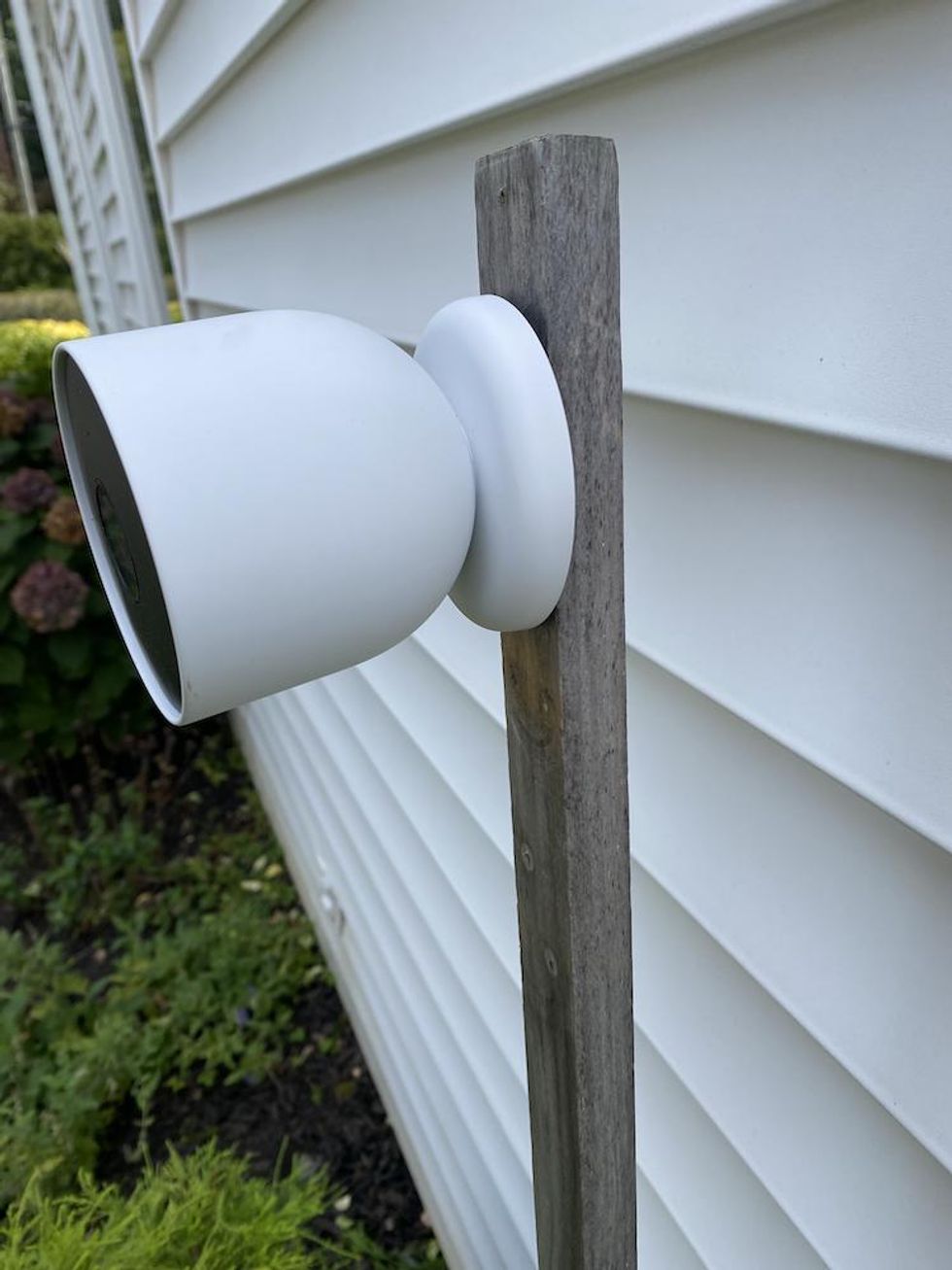 Google Nest Cam installed on the side of a house.