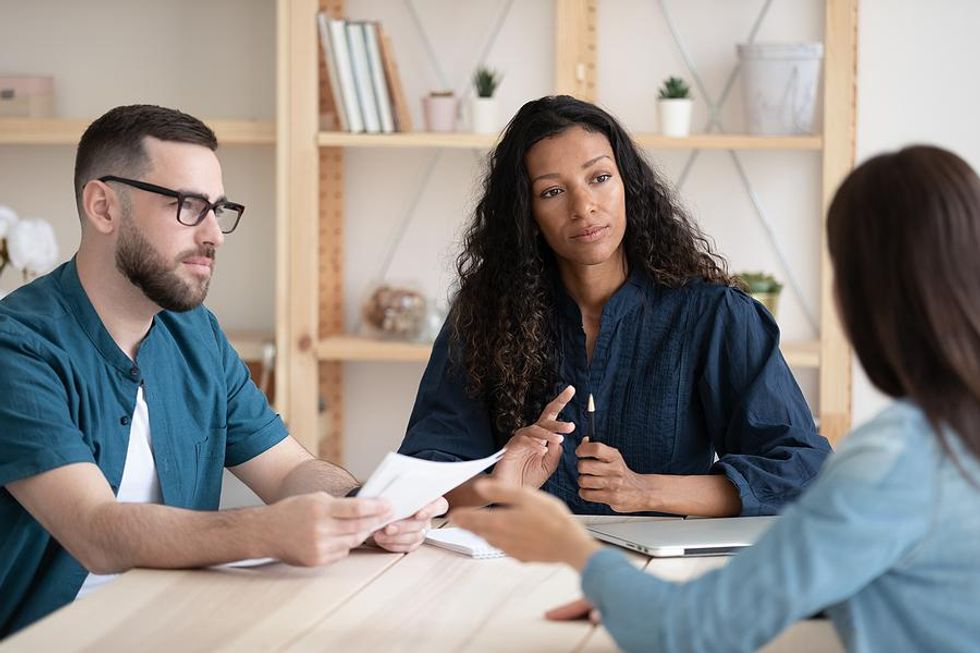 Hiring managers interview a job candidate