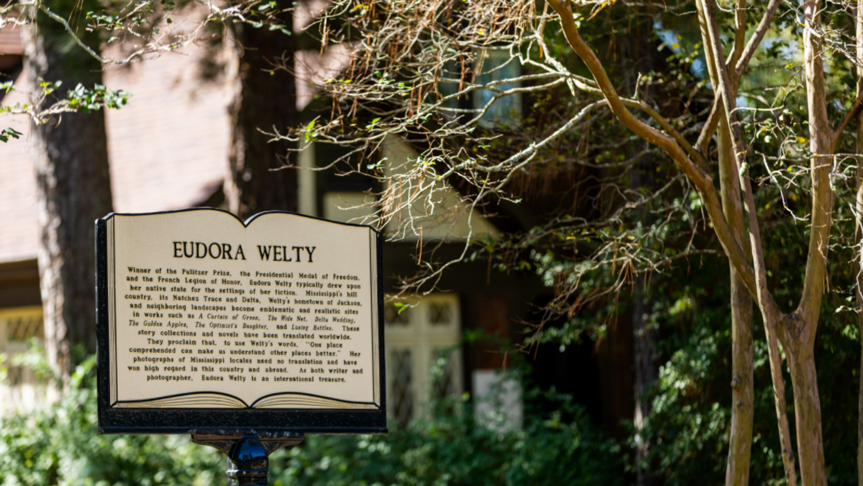 A historic marker is the shape of a book that includes facts about Eudora Welty