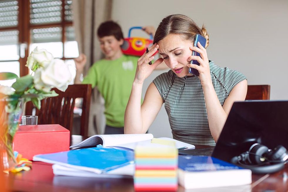 Burned out mom on a phone call