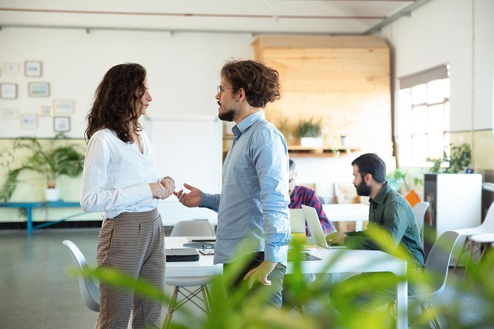 Man talks to his boss about job burnout