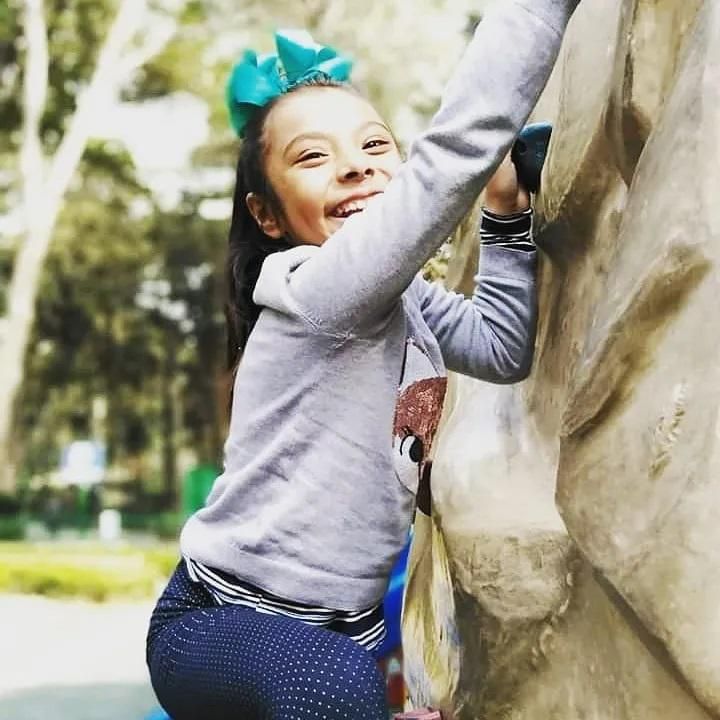 adhara rock climbing and smiling