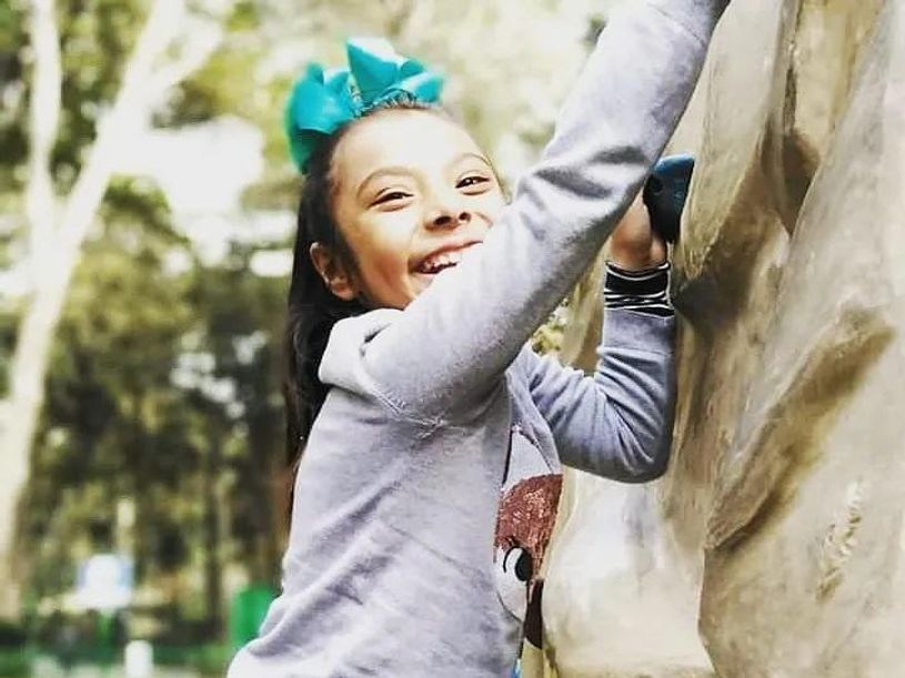 adhara rock climbing and smiling