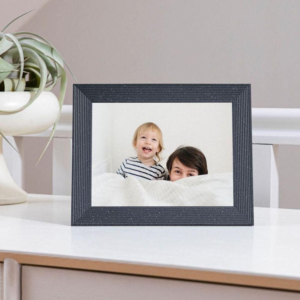 Mason Lux by Aura photo frame on a table top.