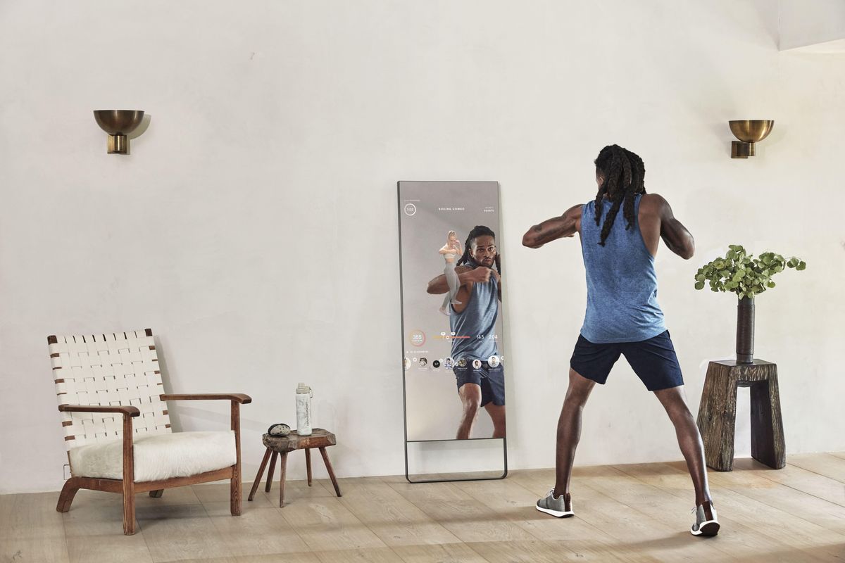 man working out with the mirror 