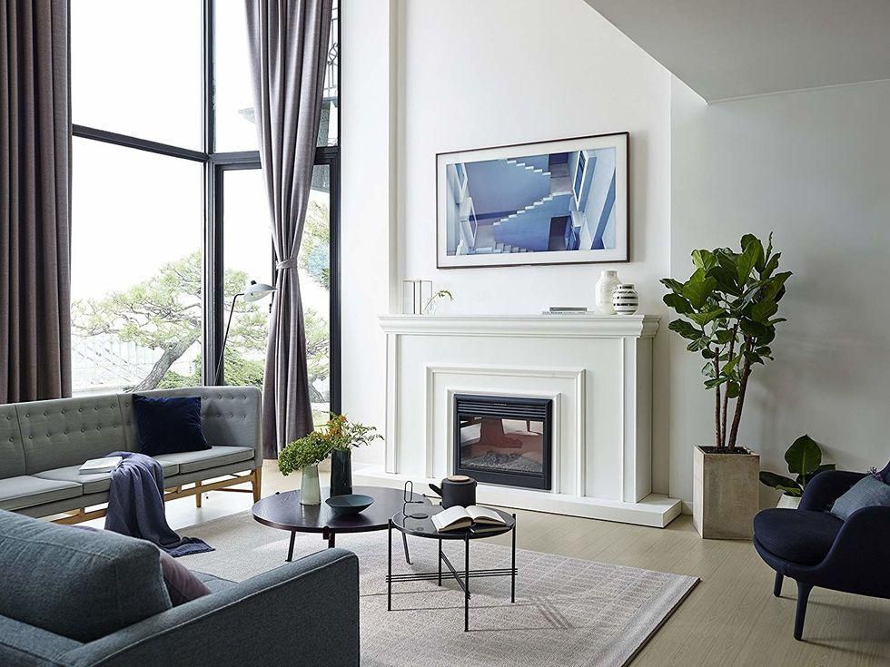 Samsung The Frame TV on a wall in a living room.