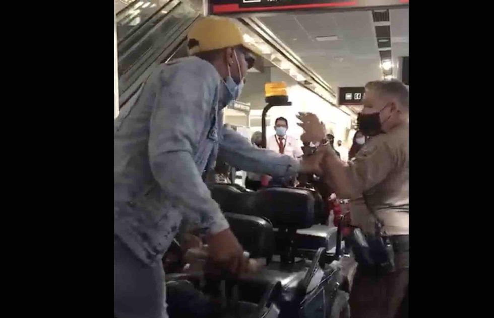Cop pulls gun on mob during Miami airport brawl; passenger who lost it over delayed flight had just bitten officer’s head, police say