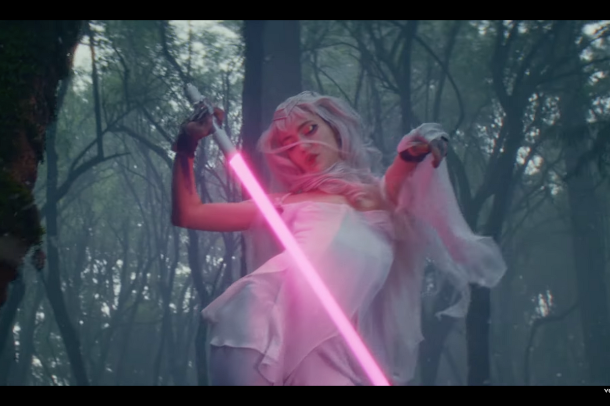 Watch Grimes' lightsaber-wielding video for 'Player Of Games