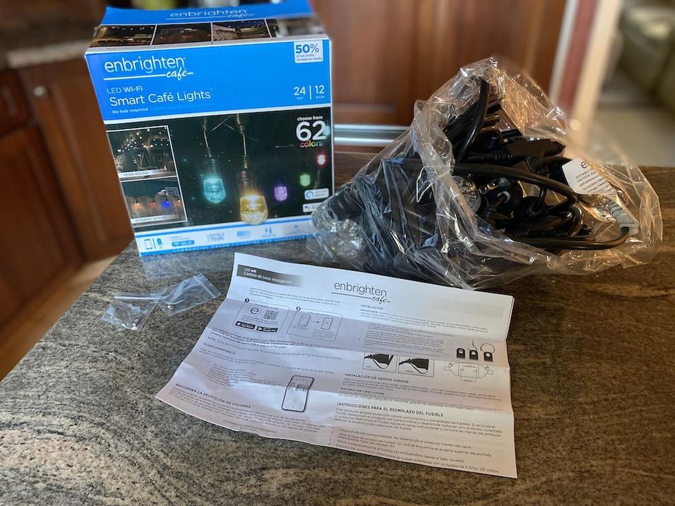 Unboxing of Enbrighten WiFi Smart Cafe Lights\u00a0on a counter