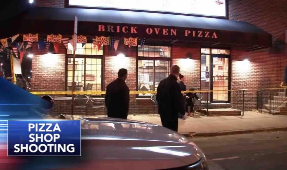 Boy, 14, shoots would-be robber in face as culprit was strangling his mother in pizza shop where she works