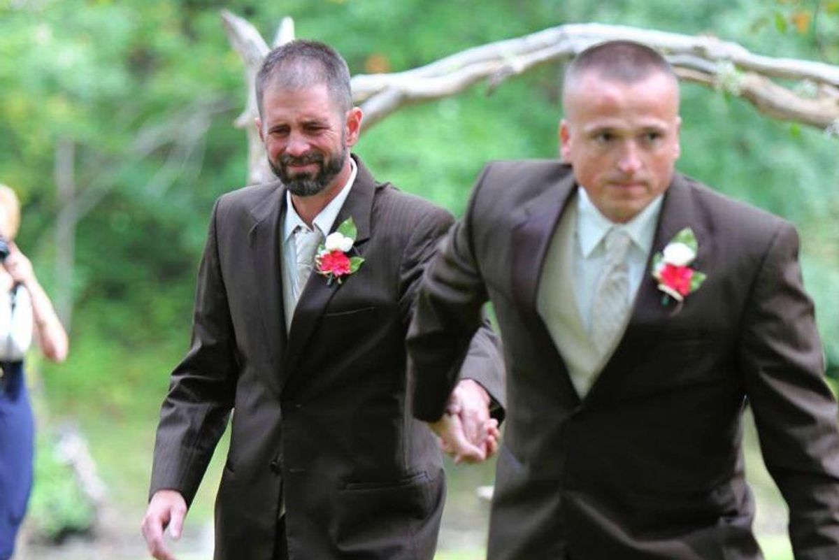 two men in tuxedos at a wedding