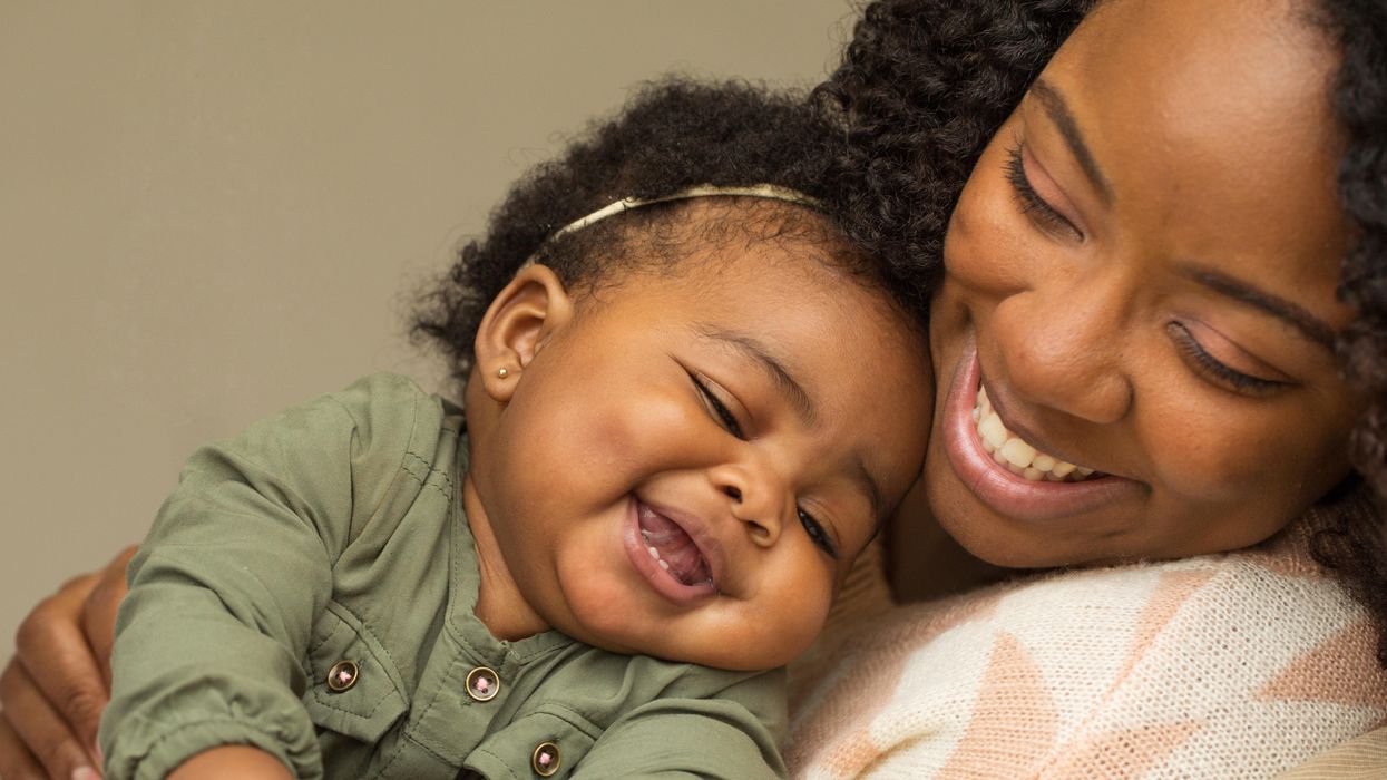 Mom cuddling an infant