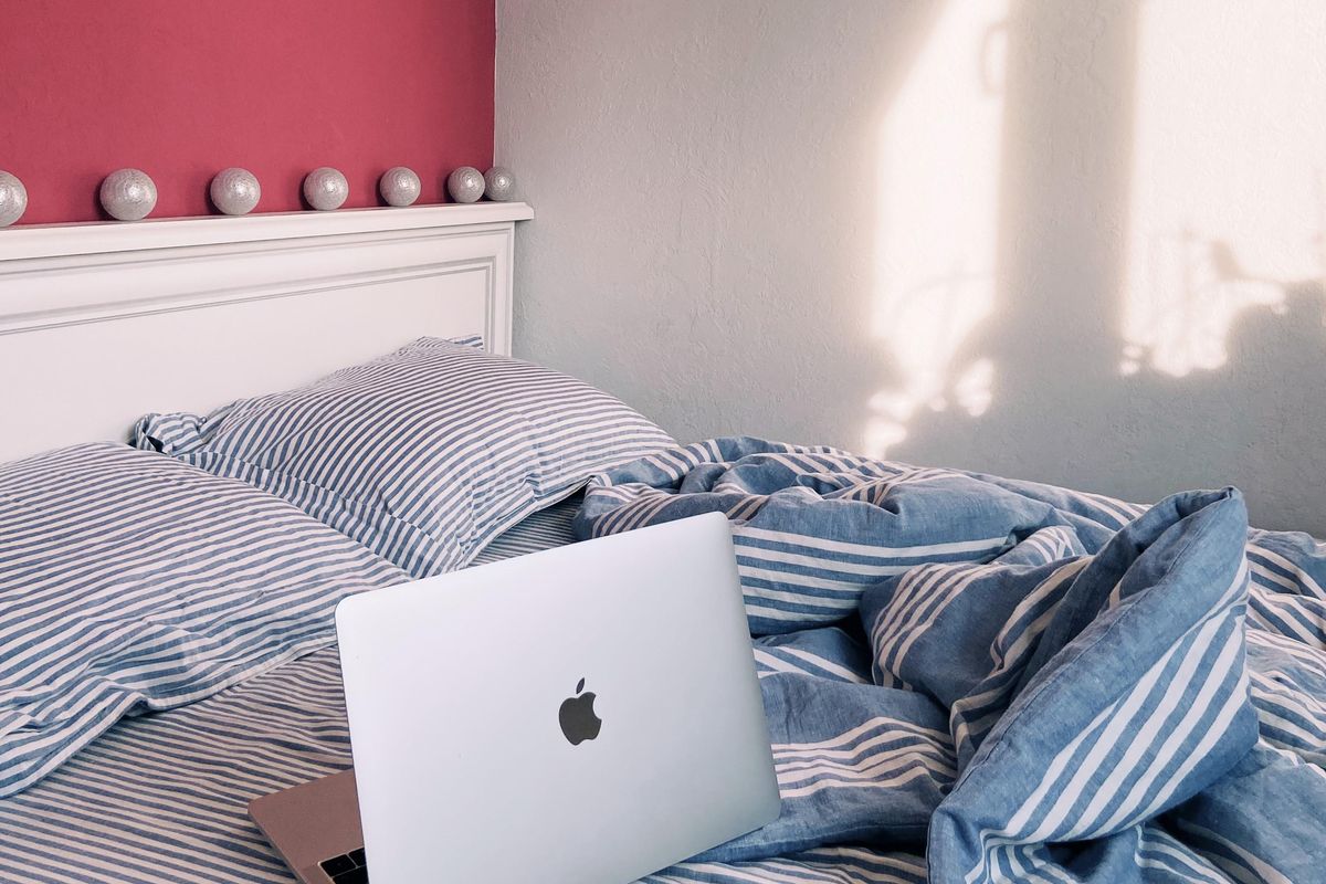 College student's bed prepped with a Sleepyhead topper