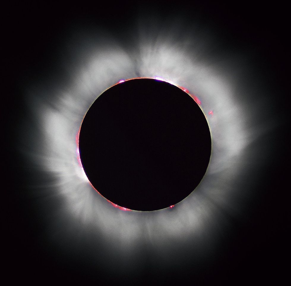 A black and white photo of a solar eclipse