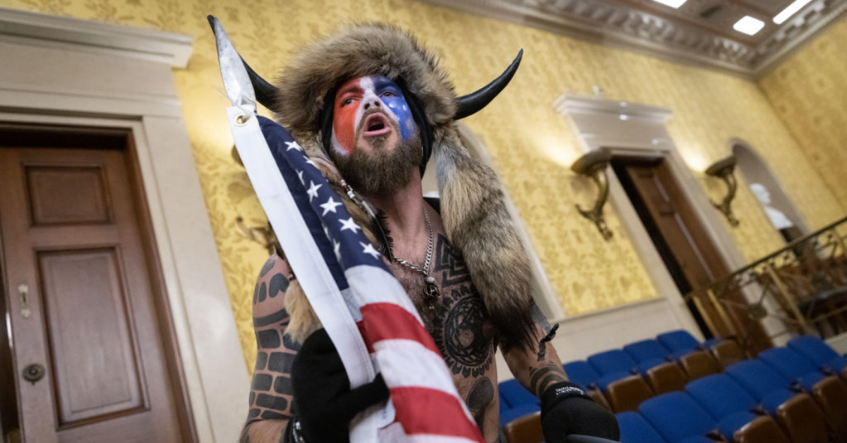 Infamous 'QAnon Shaman' Offers Bonkers New Claim For What He Was Really Doing On Jan. 6