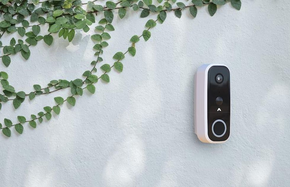 abode video doorbell on a wall