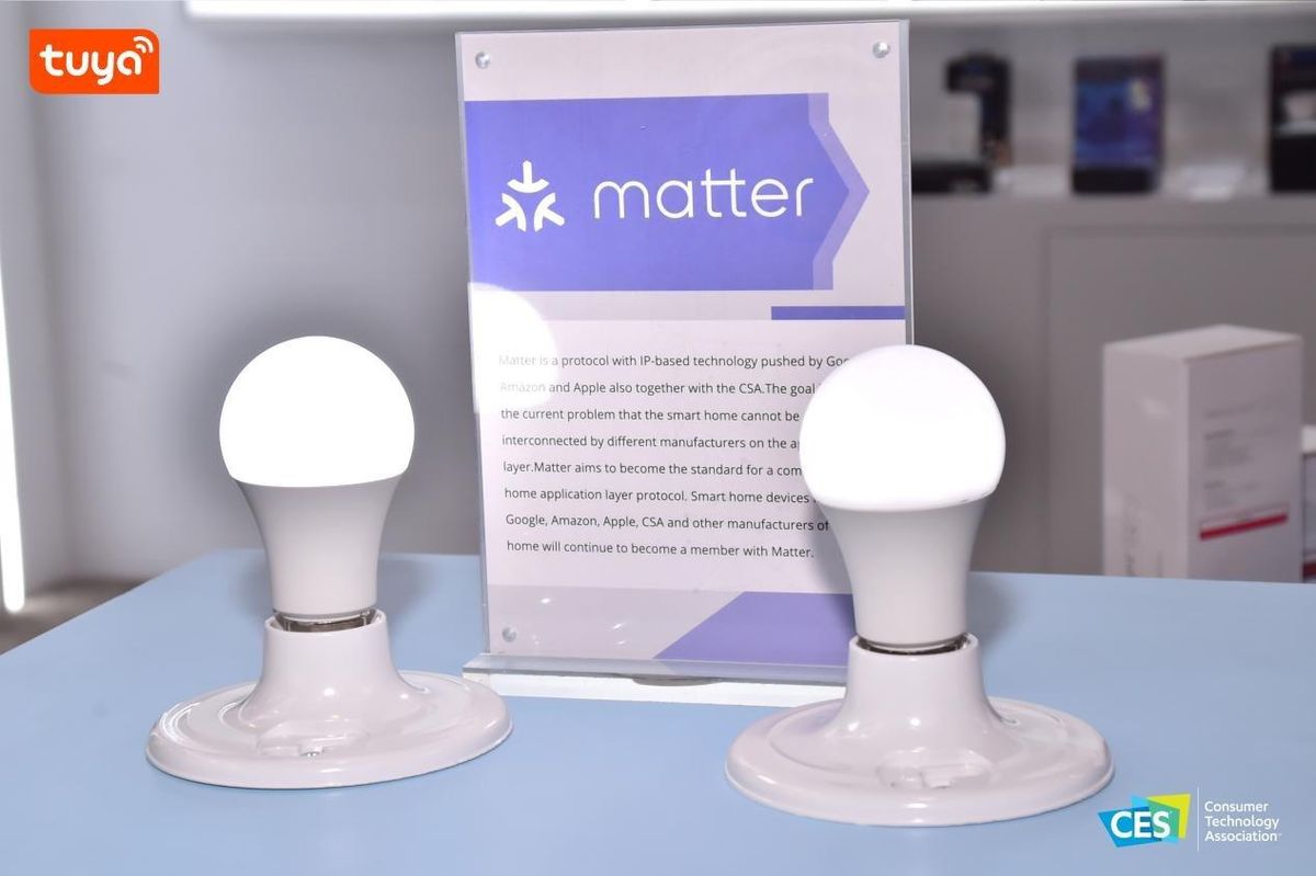 A photo of Tuya's Matter announcement at CES with smart light bulbs