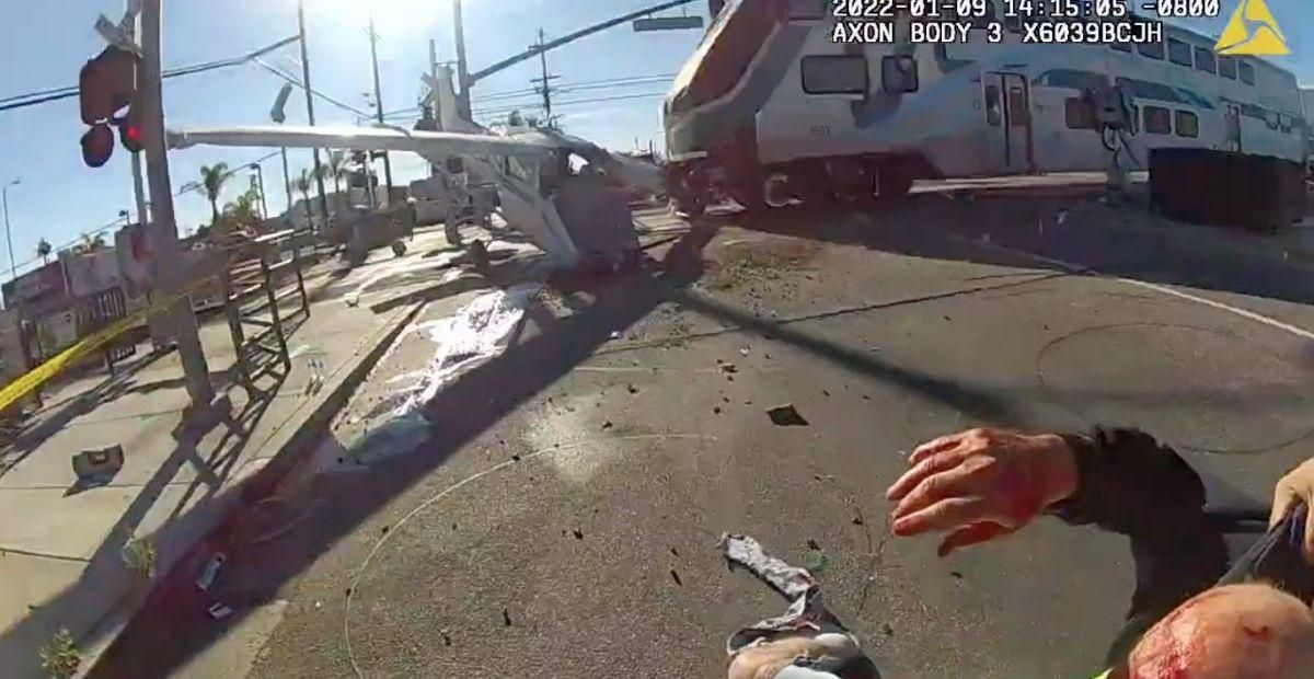 Officers pull man from his crashed airplane mere seconds before a train barrels into it