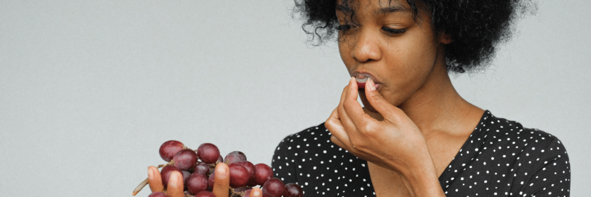 woman eating grapes