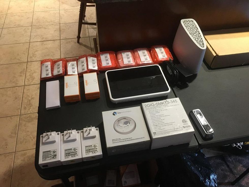Photo of Vivint Smart Home Security devices on a table getting ready to be installed.
