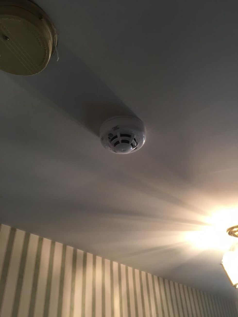 Vivint Smoke Detector installed on the ceiling inside a home.