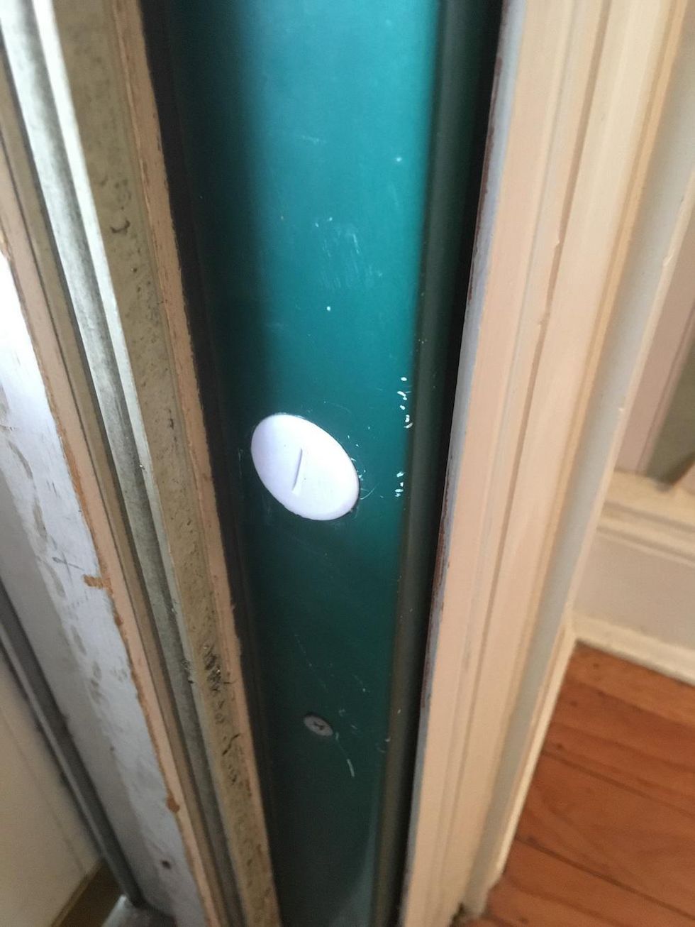 A Vivint door sensor installed on a exterior door frame.