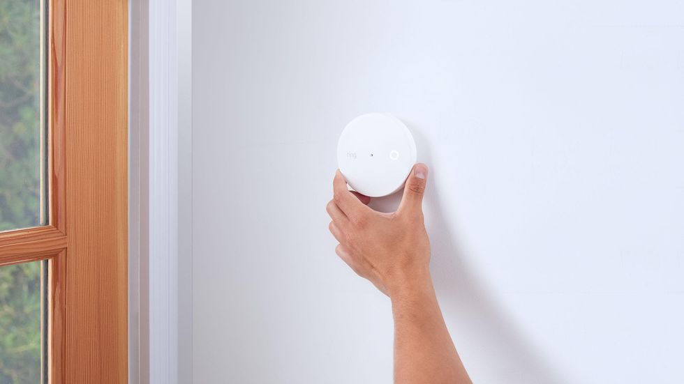 Ring Glass Break Sensor being placed on a wall