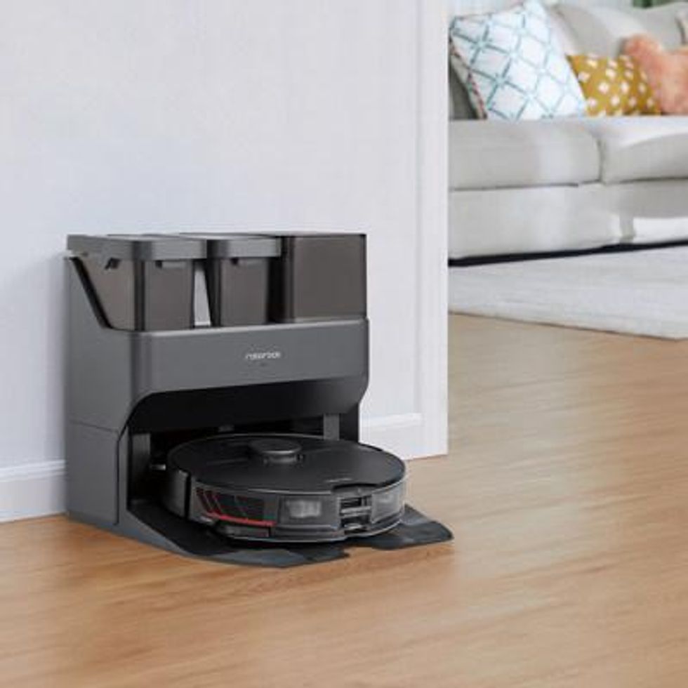 Roborock S7 MaxV Ultra robot vacuum and cleaning station in a room
