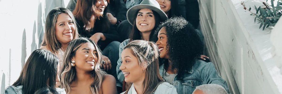 latina women sitting on a staircase