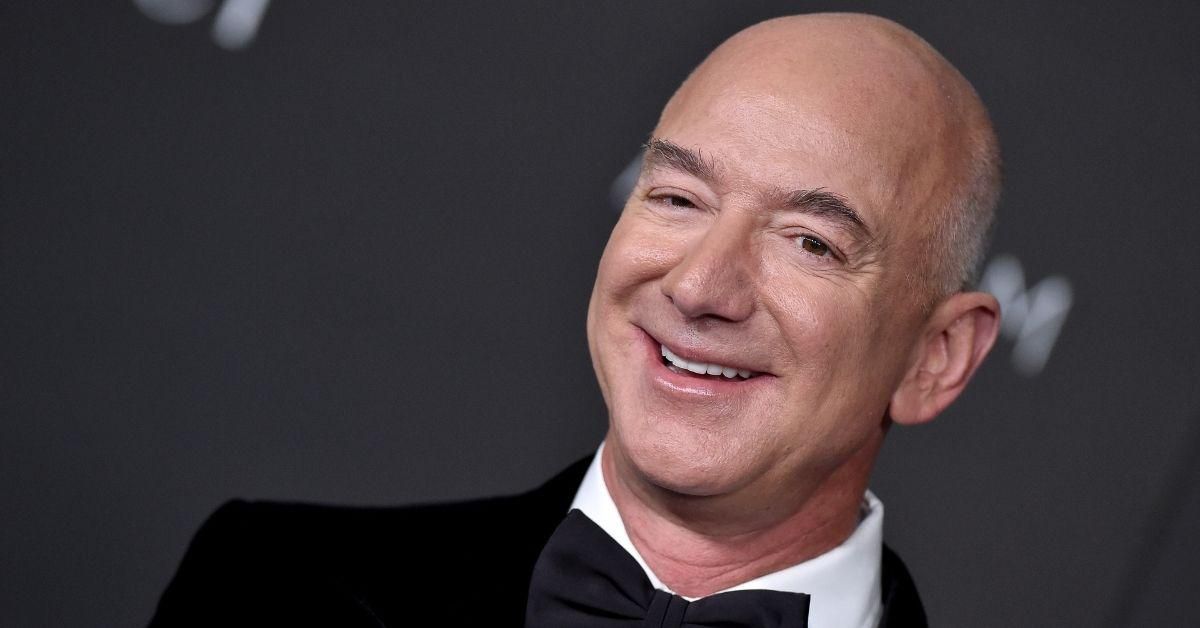Jeff Bezos Roasted After Posing With A 'Lord Of The Rings' Sign To Promote New Amazon Series