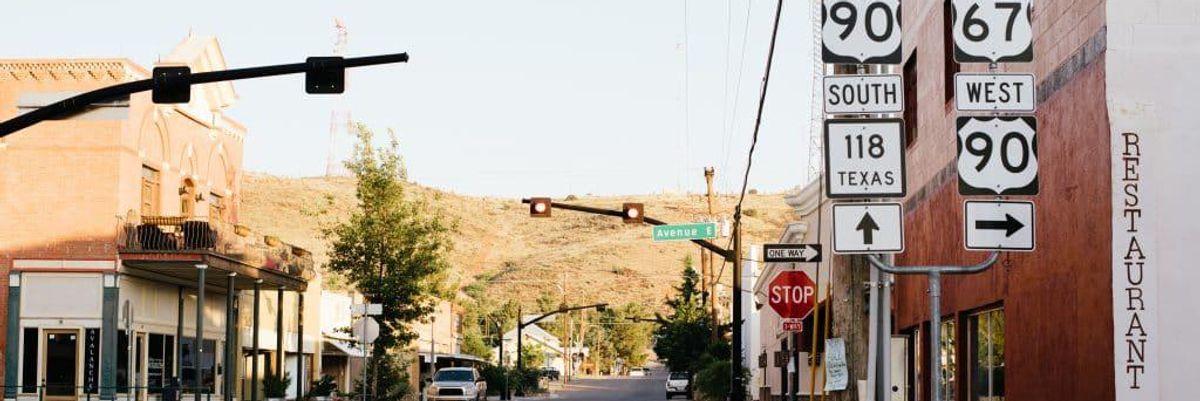 street signs for various freeways along a street in texas