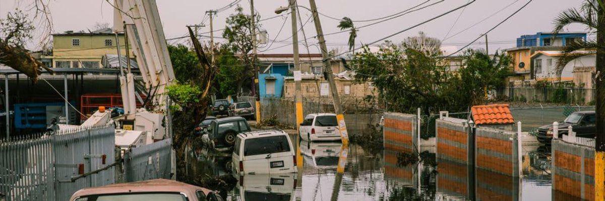 cars in neighborhood destroyed by hurricane in Puerto Rico