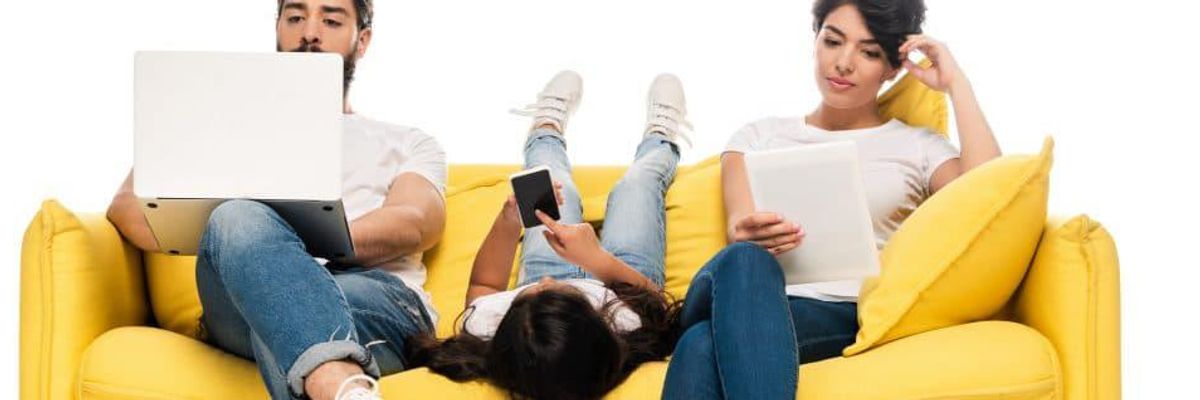 family on a couch reading